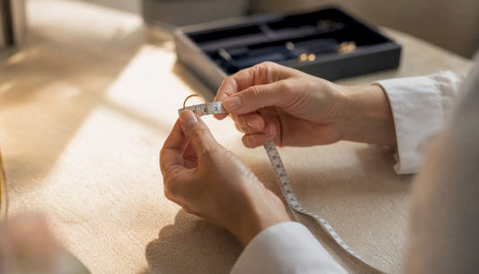 Hands measuring ring inside diameter with ruler