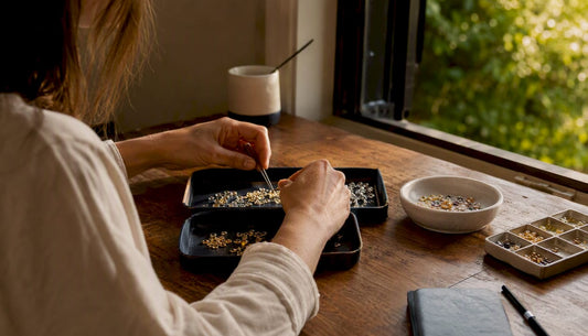 Hands selecting sustainable jewelry materials