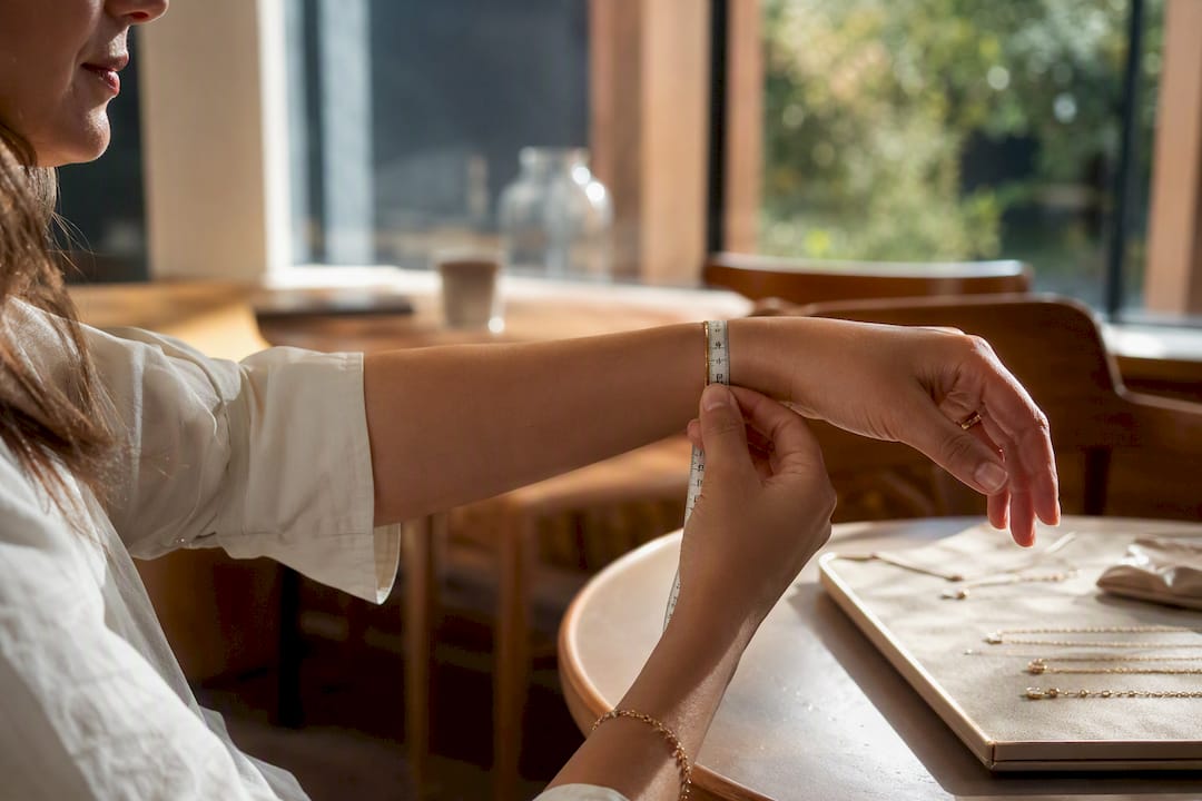 Wrist being measured with tape measure