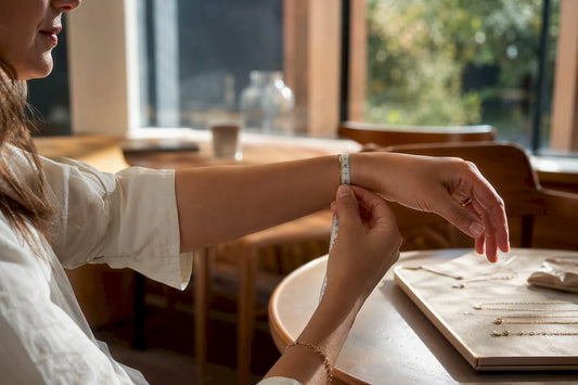 Wrist being measured with tape measure